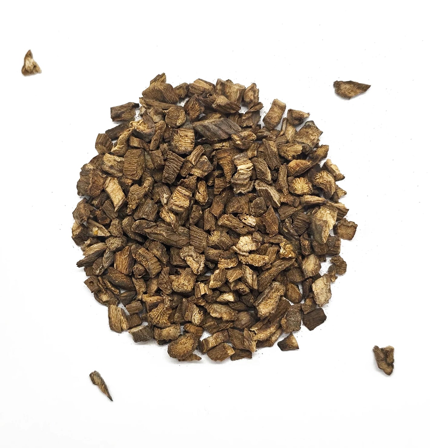 Heap of dried brown wood chips on a white background