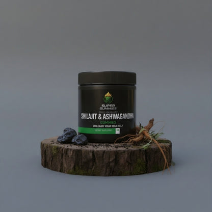 Super Gummies Shilajit & Ashvagandha supplement jar on a wooden platform with natural elements against a gray background