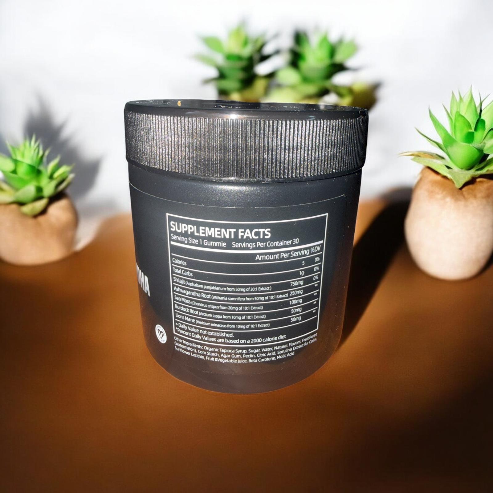 Black supplement container with label on a wooden surface with plants in the background